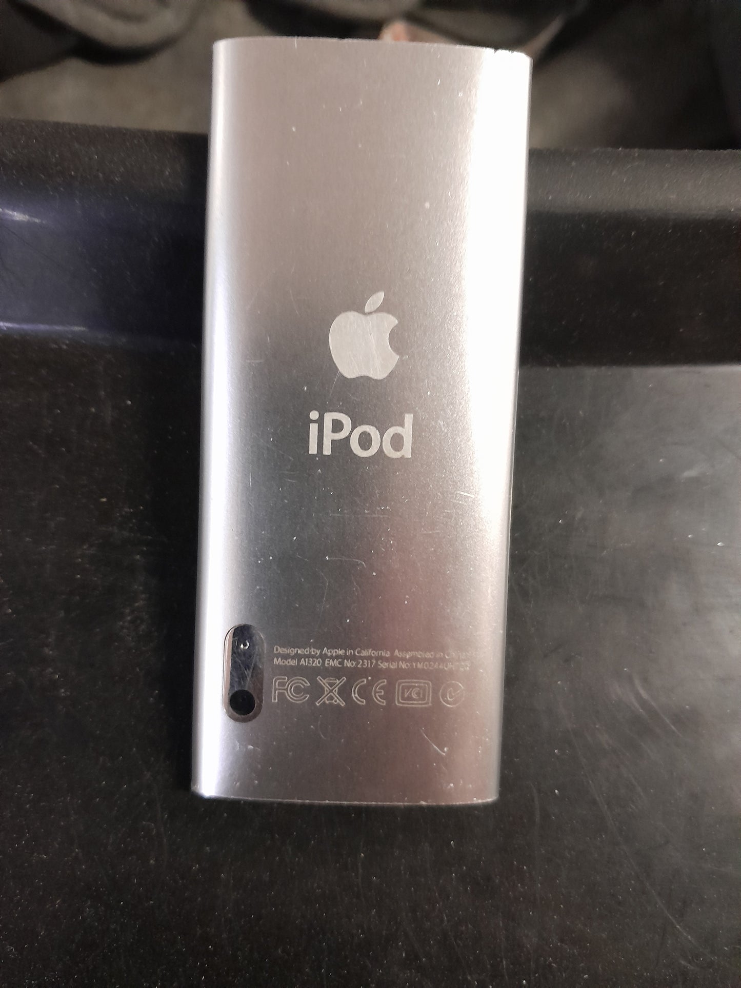 Apple iPod Nano 5th gen, 8GB model, featuring a sleek design and user-friendly interface.