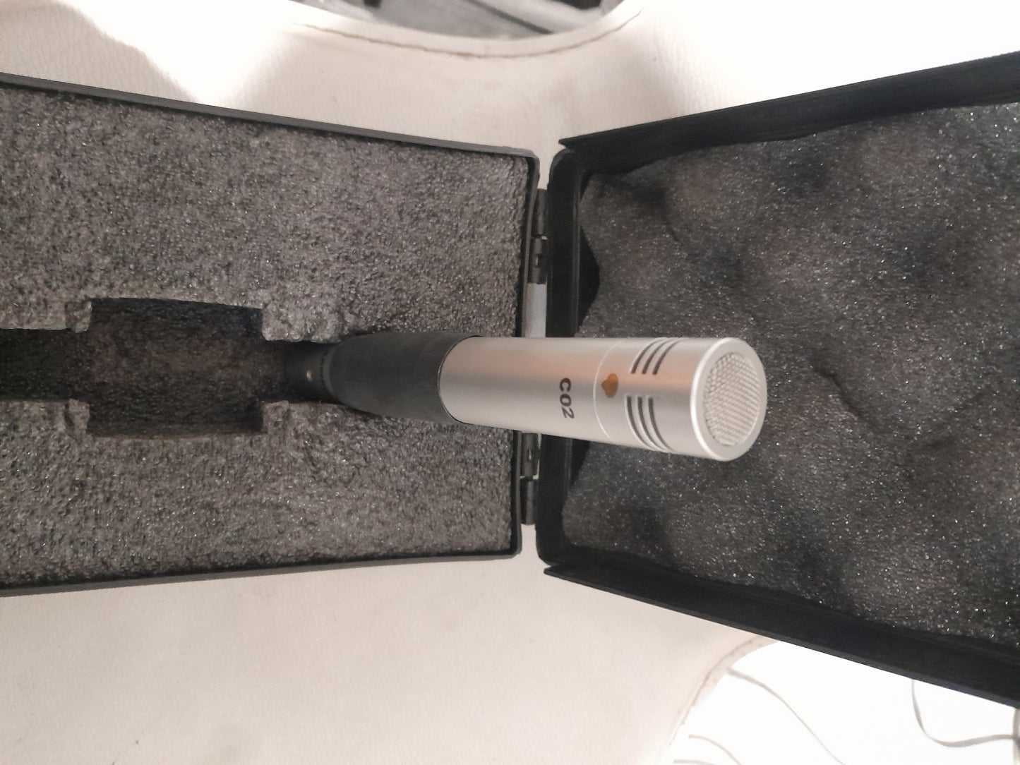 Samson C02 microphone securely placed inside its case, ready for transport and use.