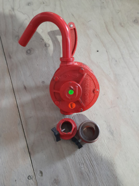 Koshin hand-operated rotary drum pump in red, ideal for dispensing various fluids efficiently.