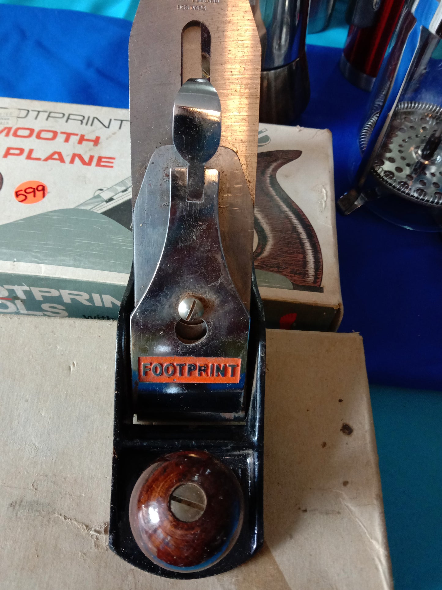 Footprint Smooth Plane with wooden handle and metal blade, shown with original packaging and price tag. Available at Die Skatkis.