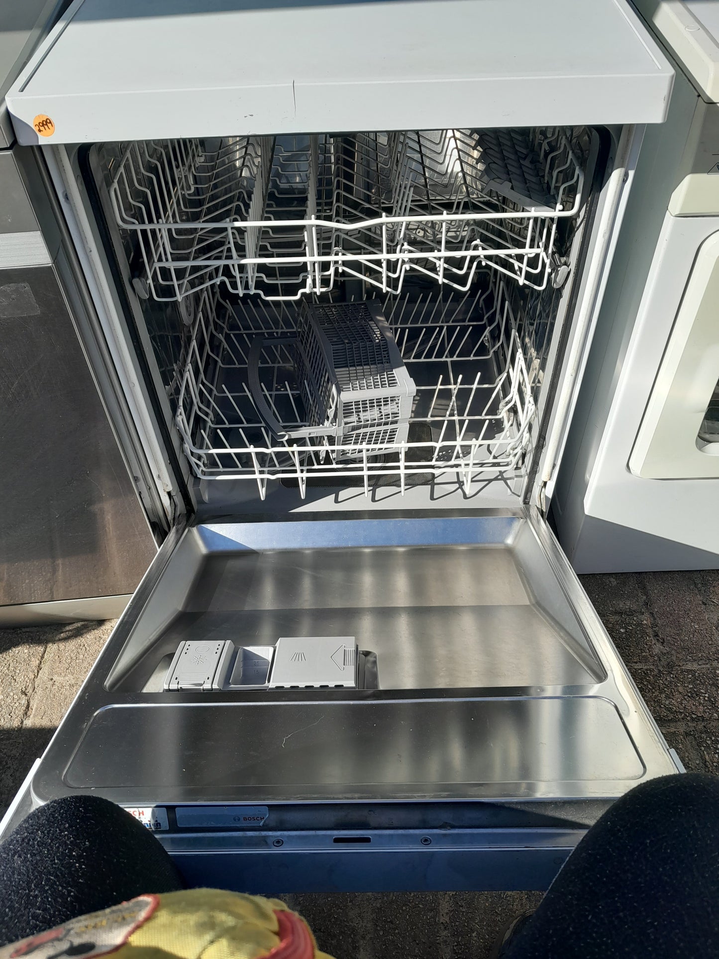 Close-up of Bosch dishwasher's clean and organized interior, perfect for secondhand purchase.