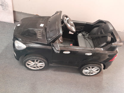 Die Skatkis secondhand store: Black Mercedes Benz kiddies car, battery-powered, showing realistic details like wheels and seatbelt.