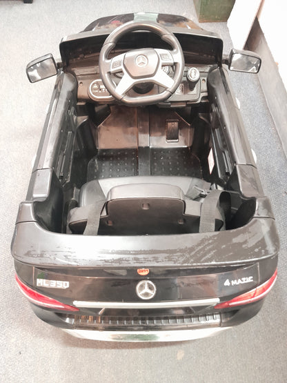 Black Mercedes Benz kiddies car, ML350 model, featuring detailed interior with steering wheel and dashboard, available at Die Skatkis.
