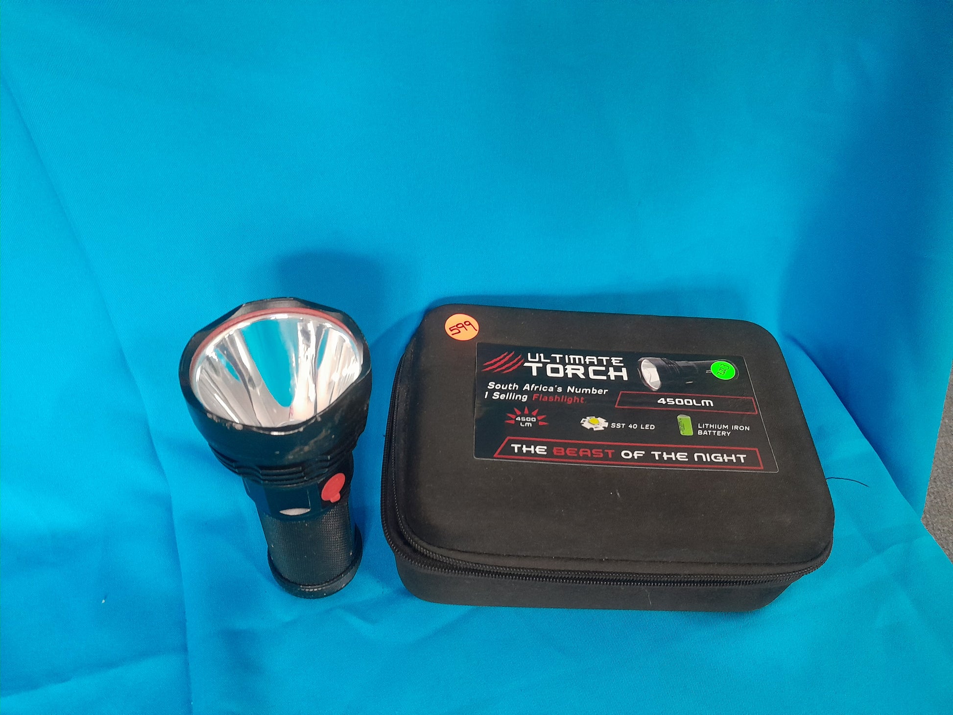 Ultimate LED Torch with 4500 LM SST 40 LED, lithium iron battery, labeled 'The Beast of the Night,' in black carrying case.