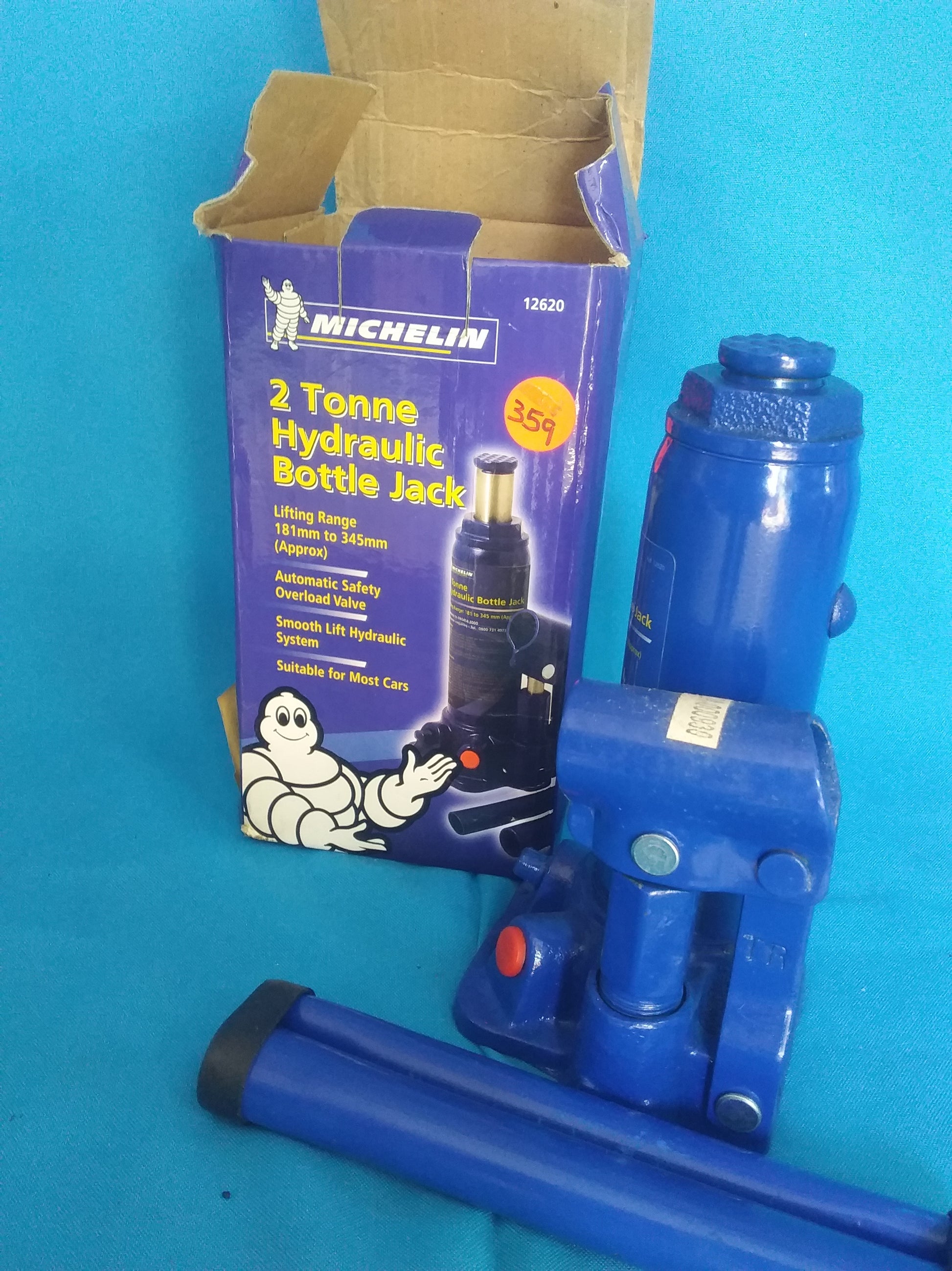 "Michelin 2 Tonne Hydraulic Bottle Jack with lifting range 181mm to 345mm, shown with blue jack and purple box featuring the Michelin logo and mascot.