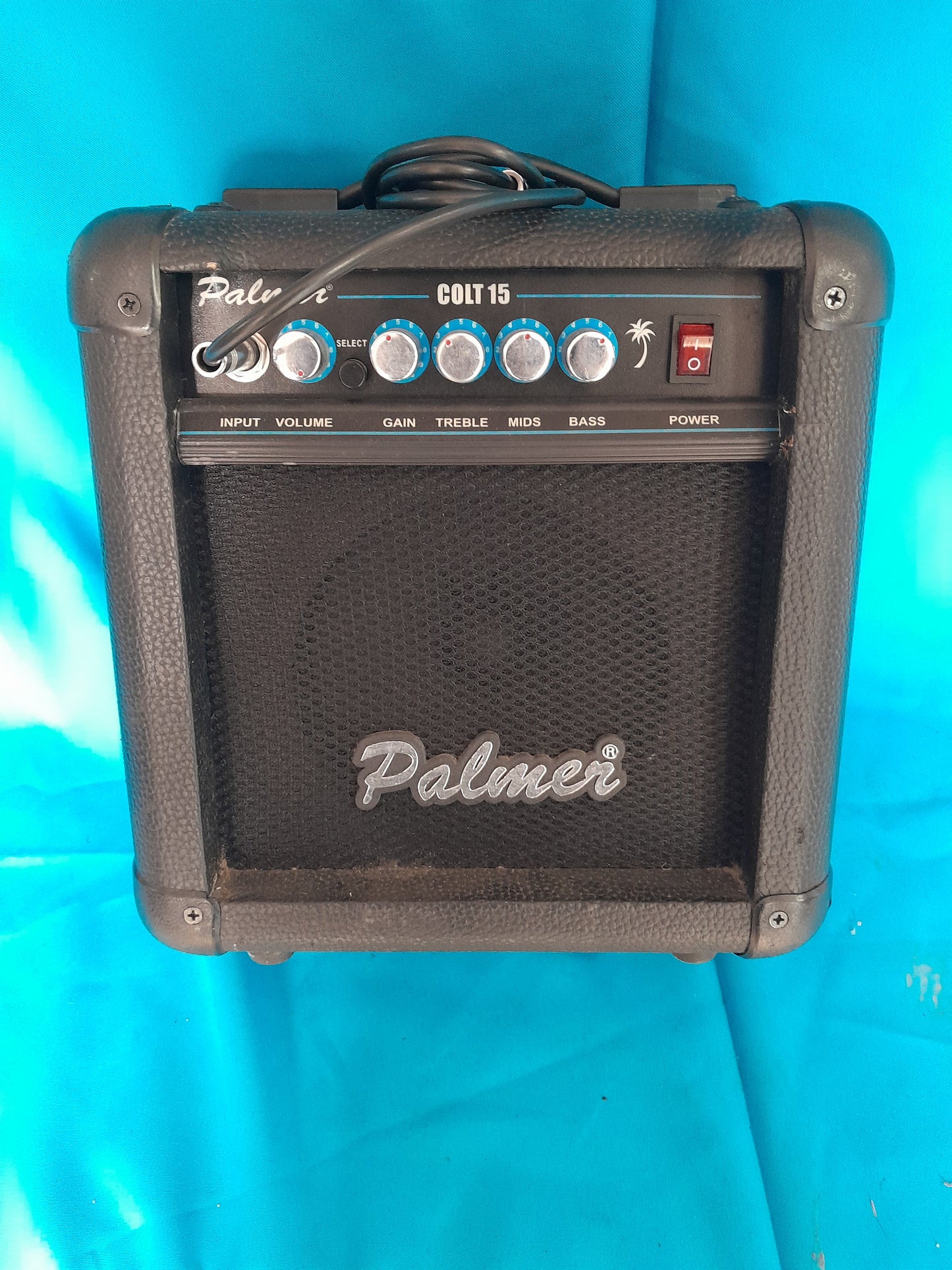 Palmer Colt 15 Guitar Amplifier in very good condition with control knobs for gain, treble, mids, bass, and volume.