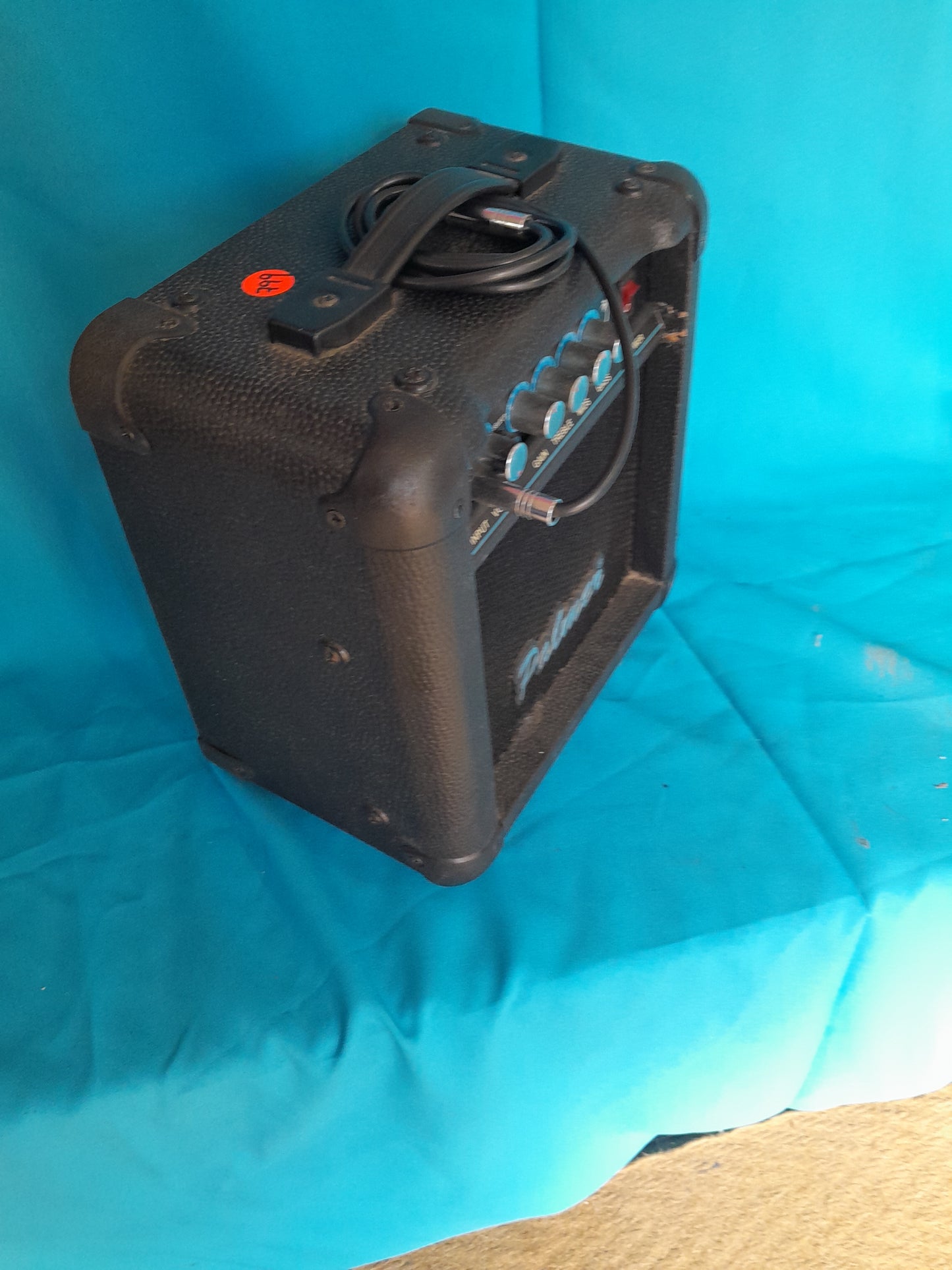 Palmer Colt 15 Guitar Amplifier with control knobs, cable input, and protective corner guards.