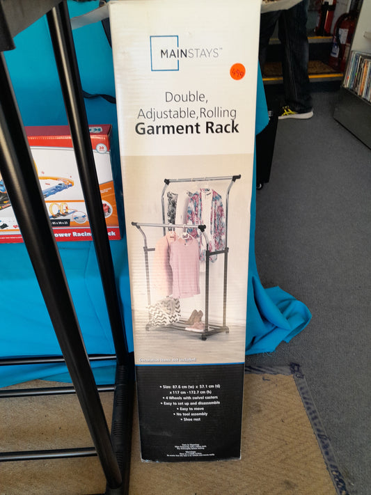 Mainstays adjustable rolling garment rack, size 87.6 cm x 57.1 cm x 117-172.7 cm, secondhand and in original box. Available at Die Skatkis.