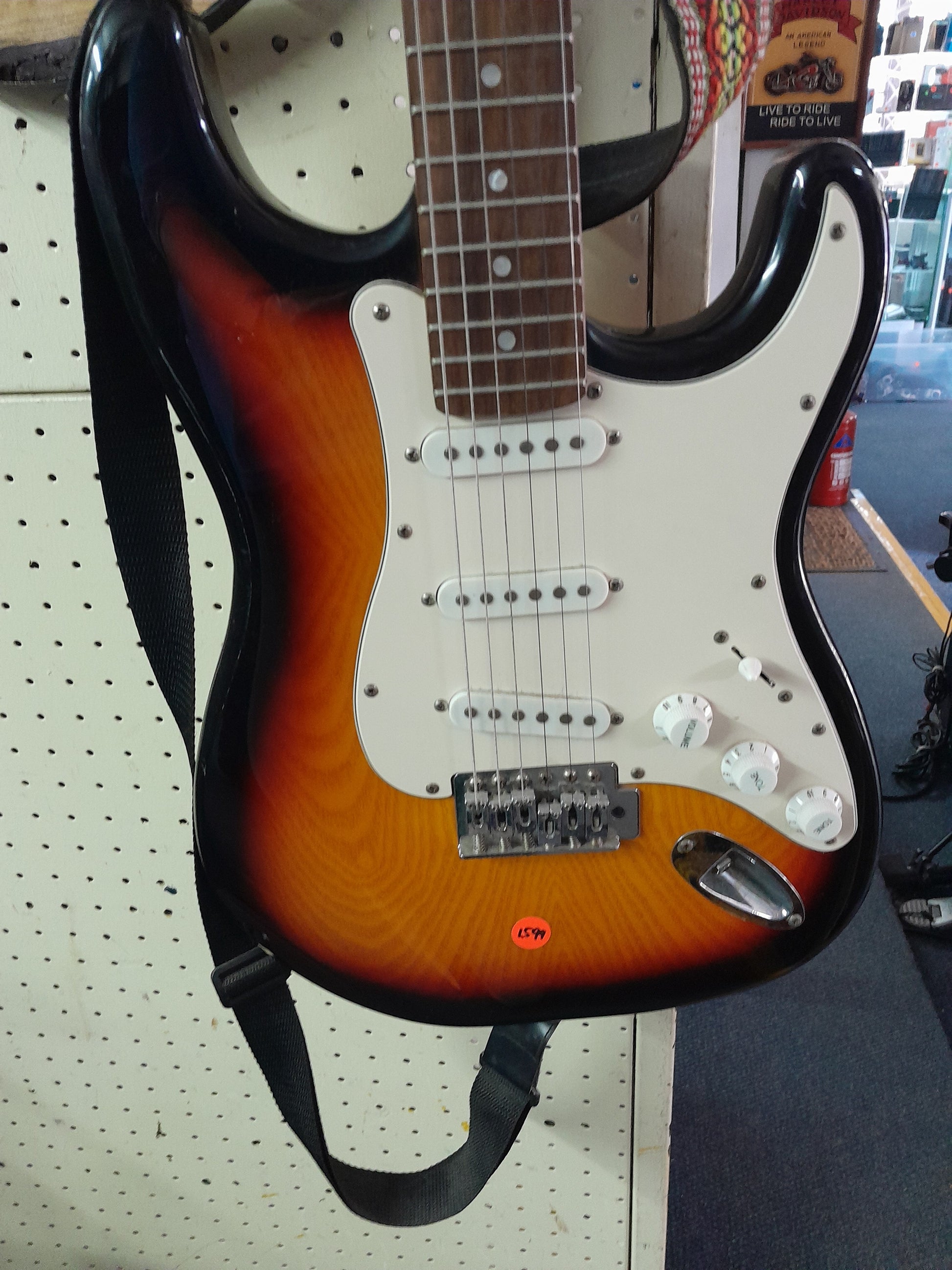 Close-up of Santa Fe electric guitar showcasing its vibrant colors and design, ideal for novice players.