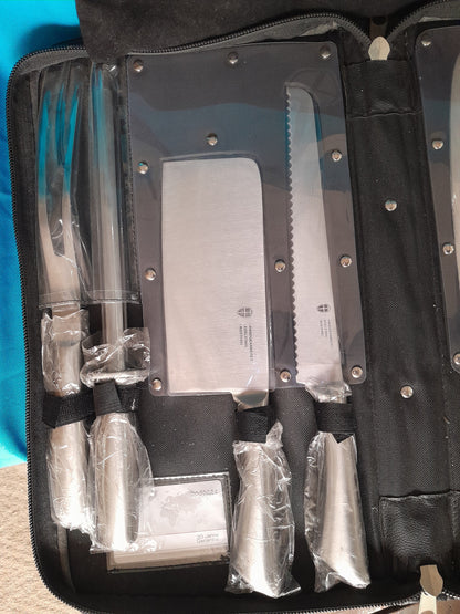 Professional kitchen knife set featuring a chef's knife, cleaver, and more in a compact storage case.