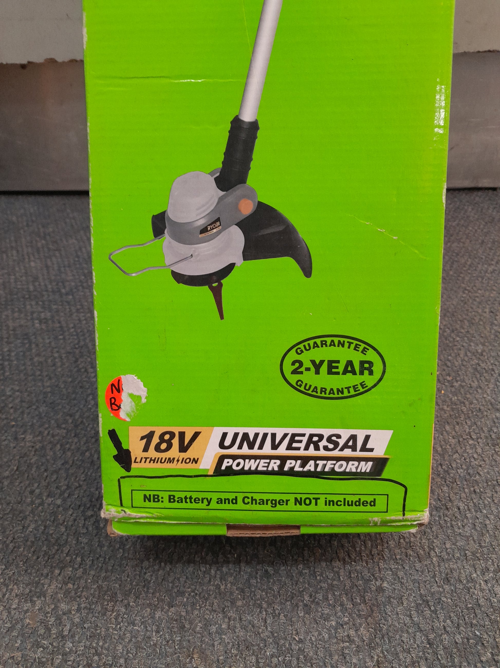Ryobi 18V Lithium Ion Garden Trimmer in green packaging, available at Die Skatkis online secondhand store.