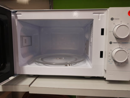 Interior view of a Logik 20 Litre microwave, showcasing the glass turntable and control dials, available at Die Skatkis secondhand store.