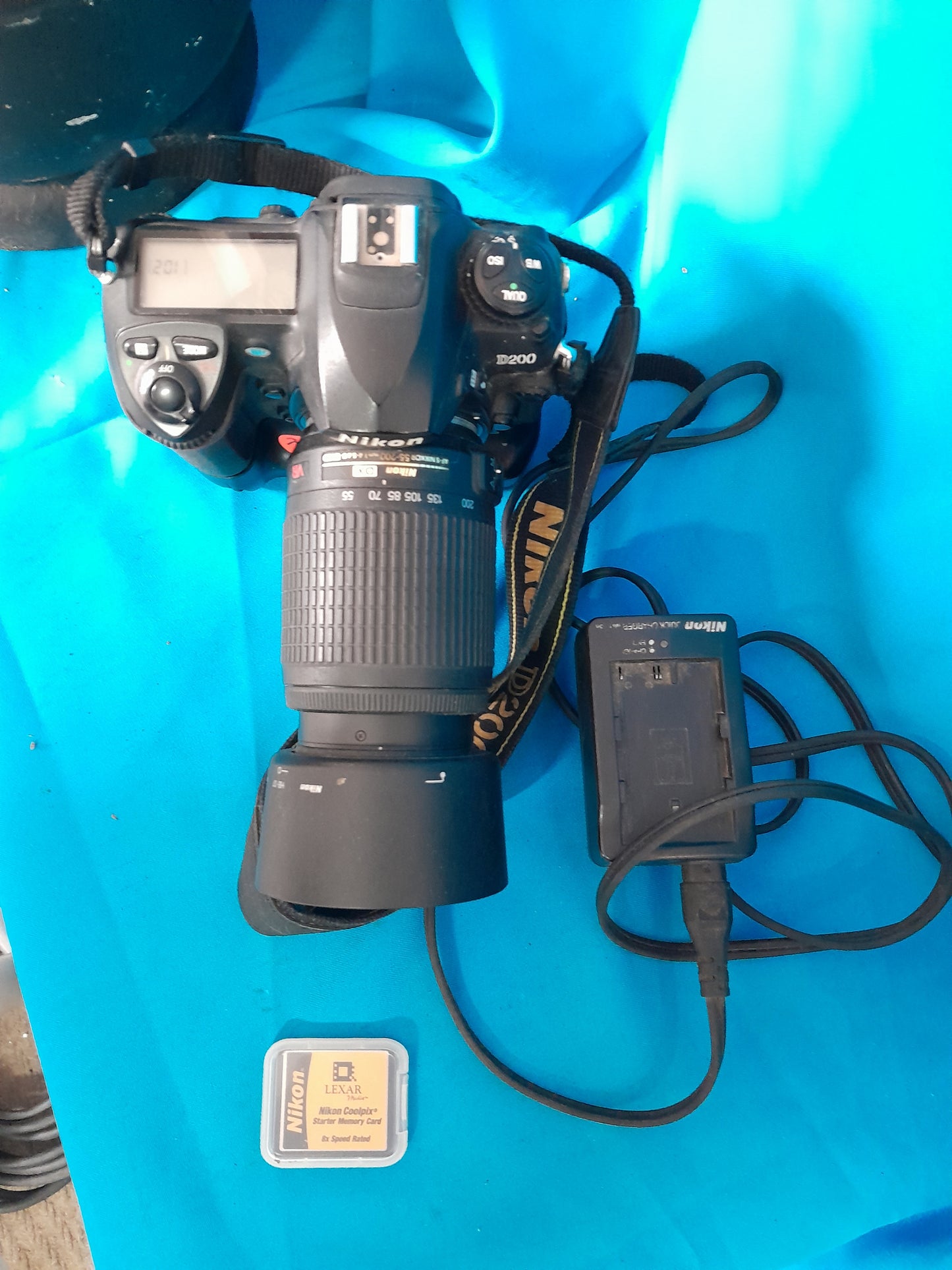 Top view of Nikon D200 camera showcasing controls and lens, perfect for photography enthusiasts.