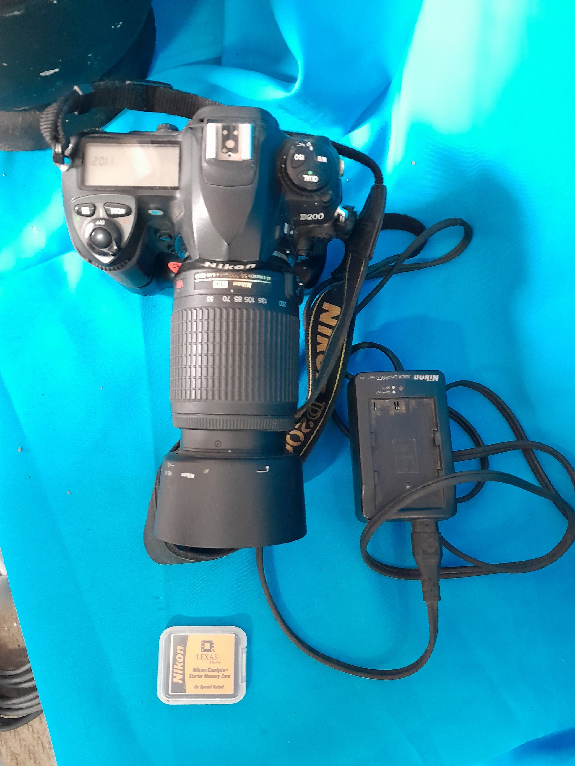 Top view of Nikon D200 camera showcasing controls and lens, perfect for photography enthusiasts.