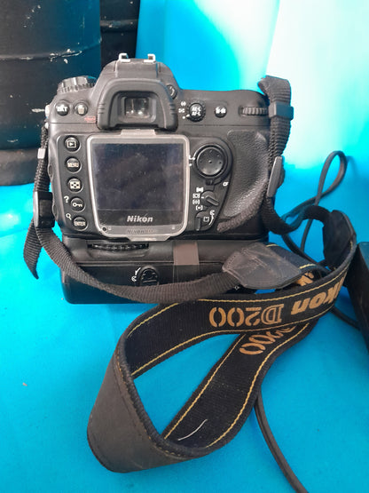 Detailed view of Nikon D200 camera with strap and battery, great for amateur and professional photographers