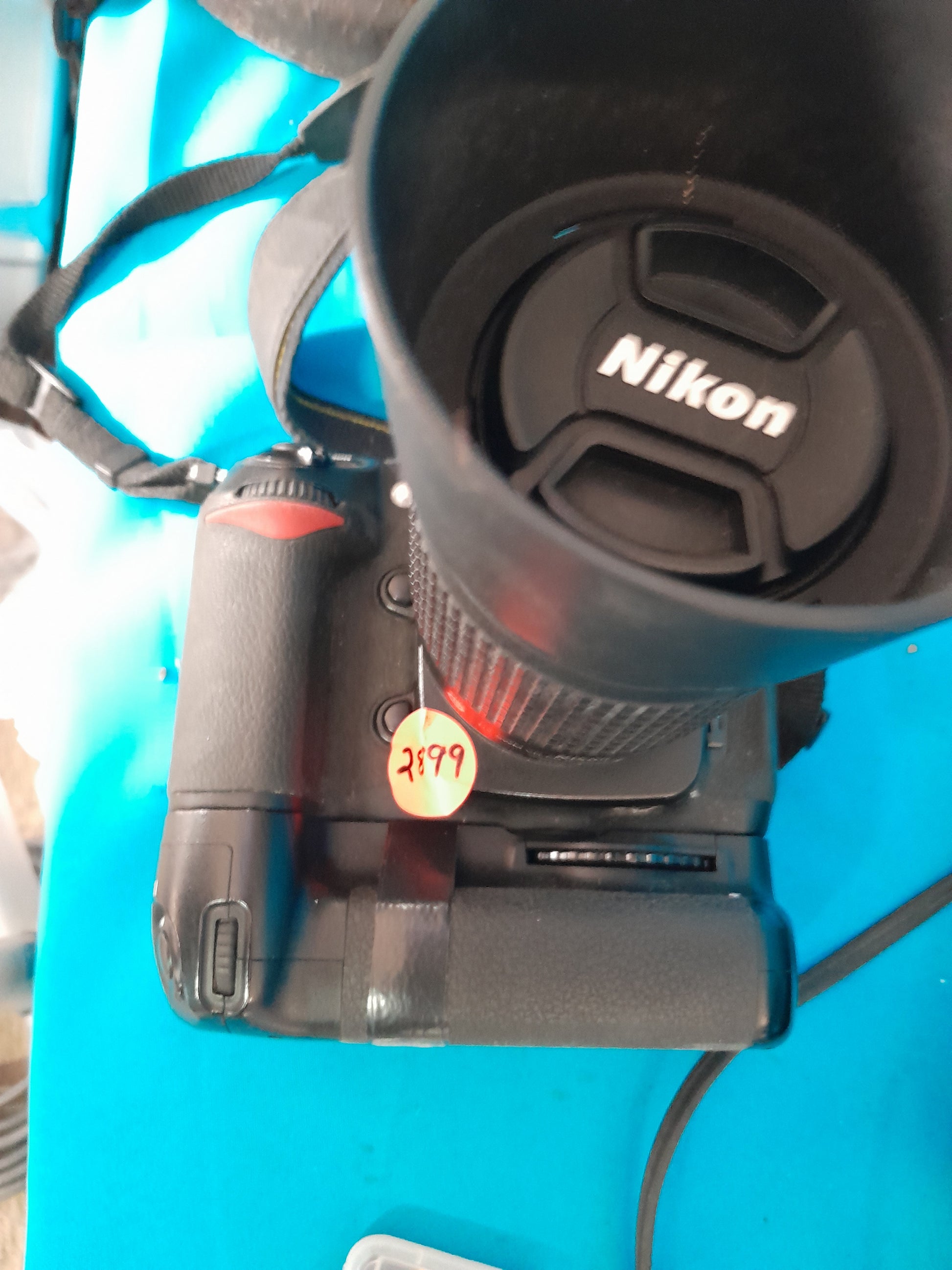 Close-up of Nikon D200 camera showing details and lens, a great secondhand option for photographers.