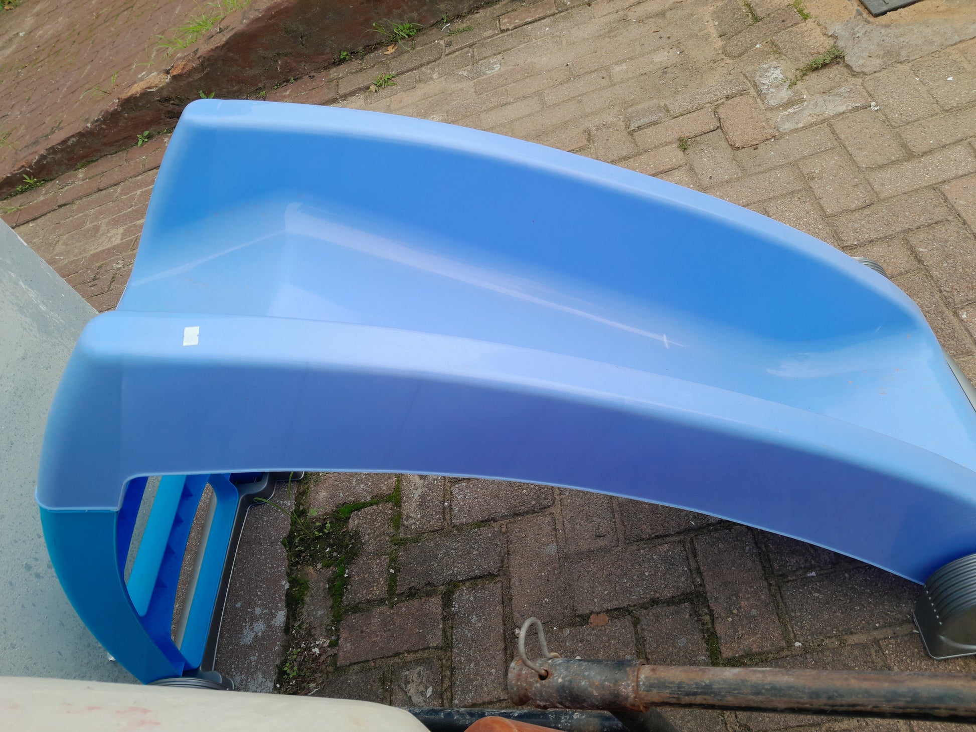 Durable blue kiddies slide, perfect for safe outdoor play and secondhand savings.
