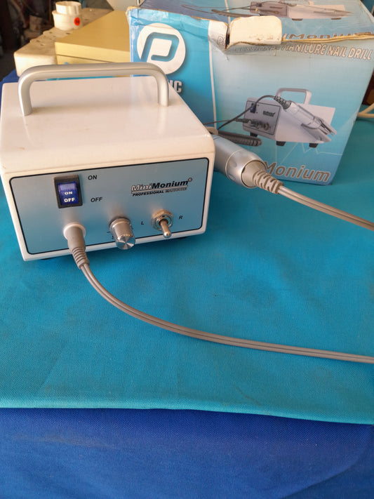 MiniMonium nail drill on a colorful background, ideal for professional nail care.