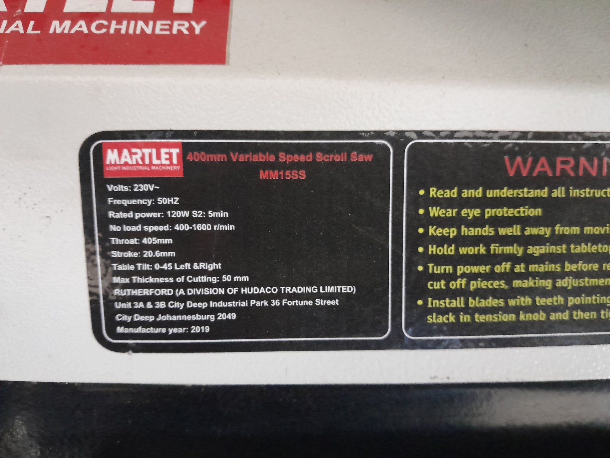 Close-up of Martlet MM15SS label detailing power specifications and cutting capabilities for woodworking enthusiasts.