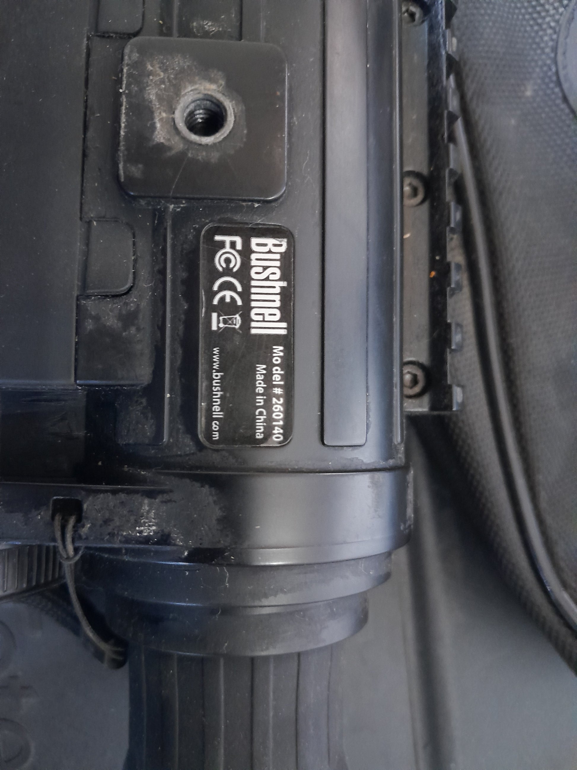 Close-up view of Bushnell Equinox Z night vision device label, showing model 260140 and certification symbols. Available at Die Skatkis.