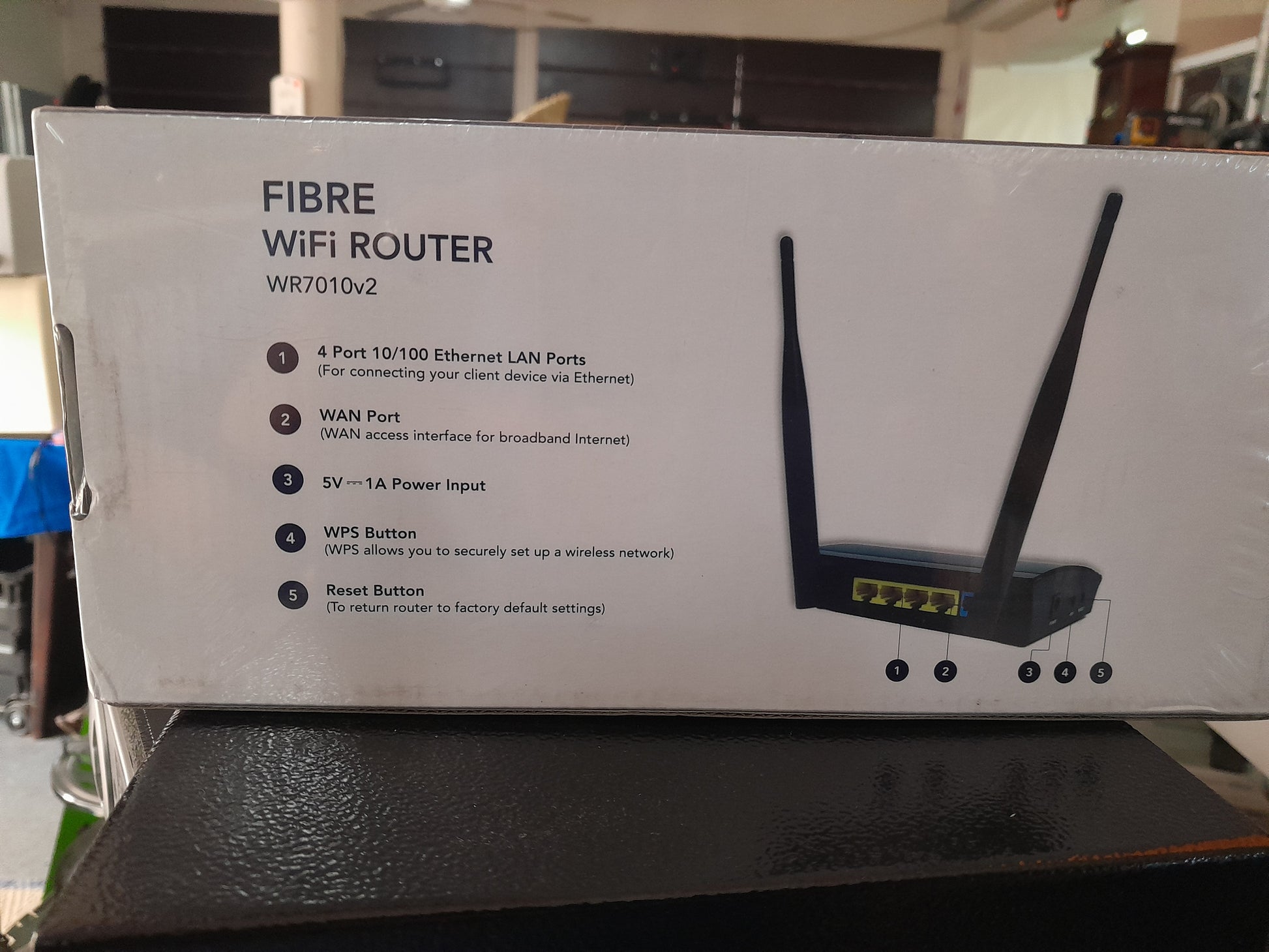 Features of the WR7010v2 Fibre Wi-Fi Router, including power input and WPS button.