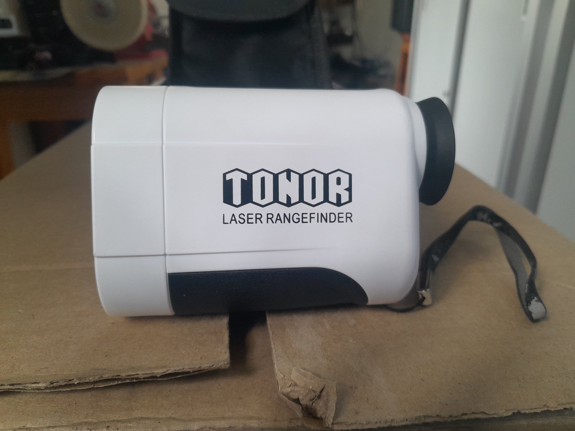 Side view of Tonor Laser Rangefinder, a waterproof and shockproof golf tool.
