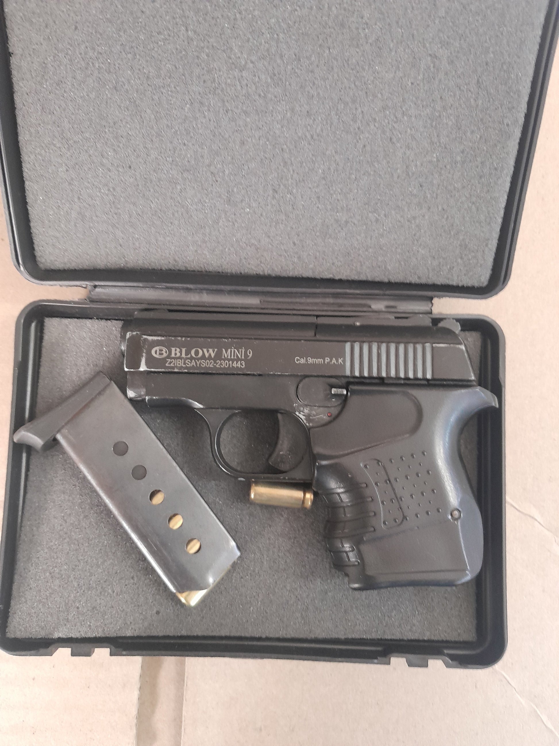 Compact Blow Mini 9 blank gun with magazine, great for training and self-defense.
