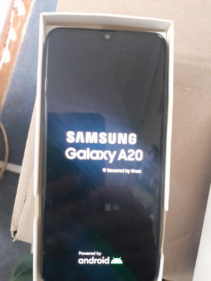 Samsung Galaxy A20 smartphone in its box, ideal for secondhand electronics shopping.