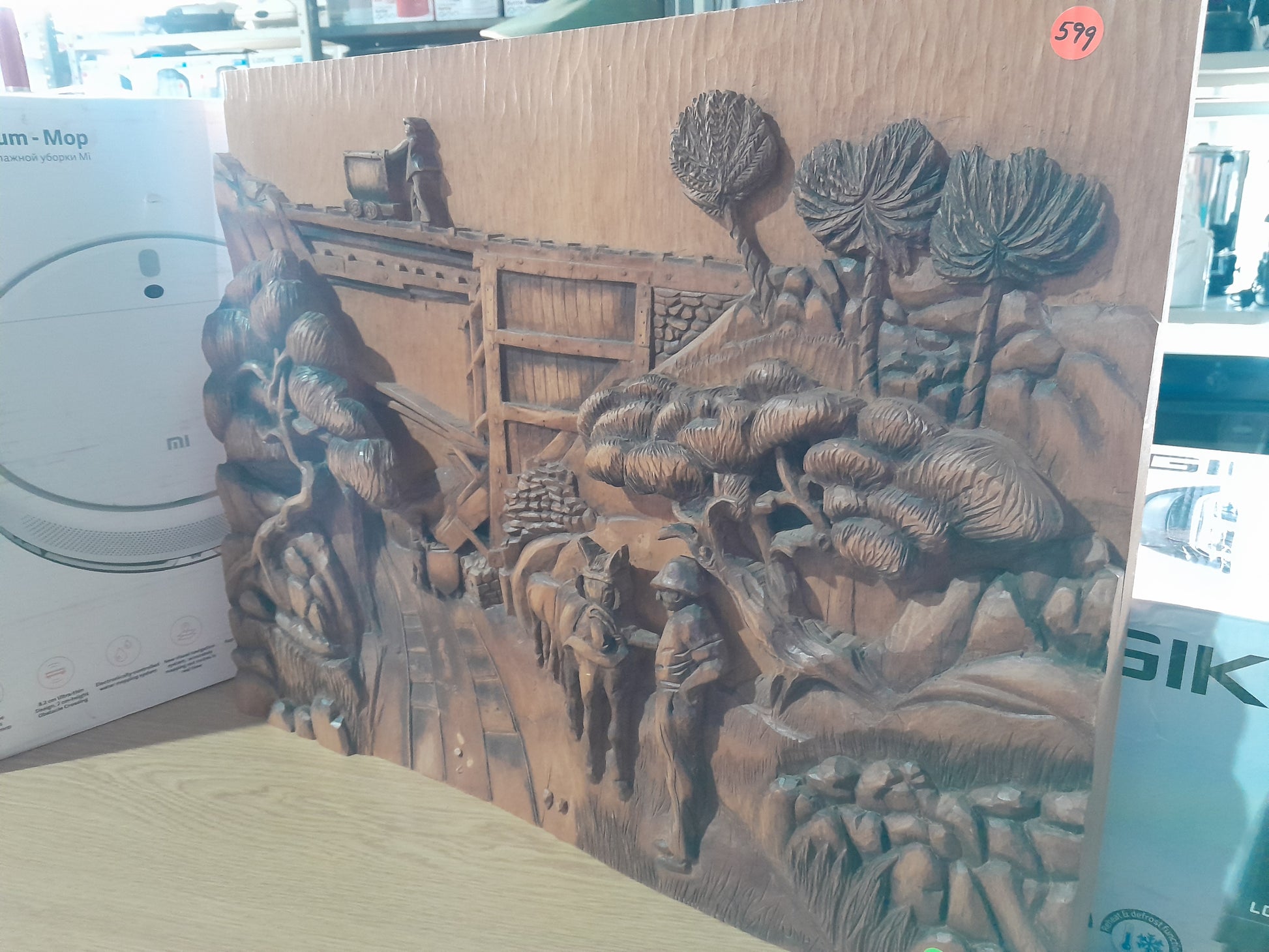 Hand-carved wooden portrait with detailed craftsmanship, perfect for home decor enthusiasts.