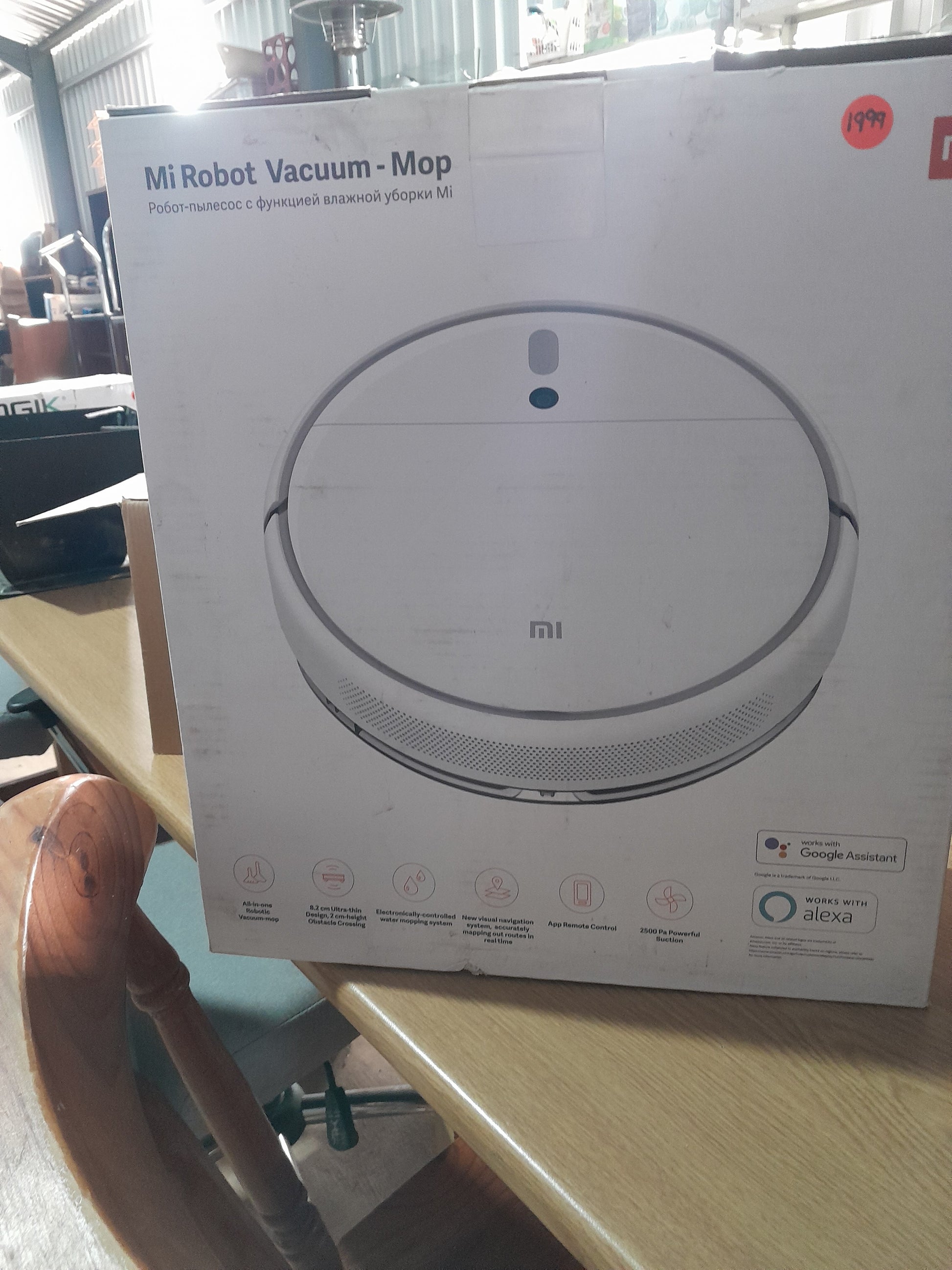 Mi Robot Vacuum Mop displayed in a secondhand store, ideal for efficient cleaning and smart home integration.