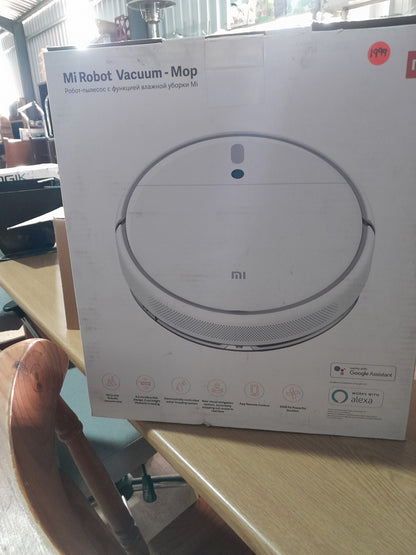 Mi Robot Vacuum Mop displayed in a secondhand store, ideal for efficient cleaning and smart home integration.