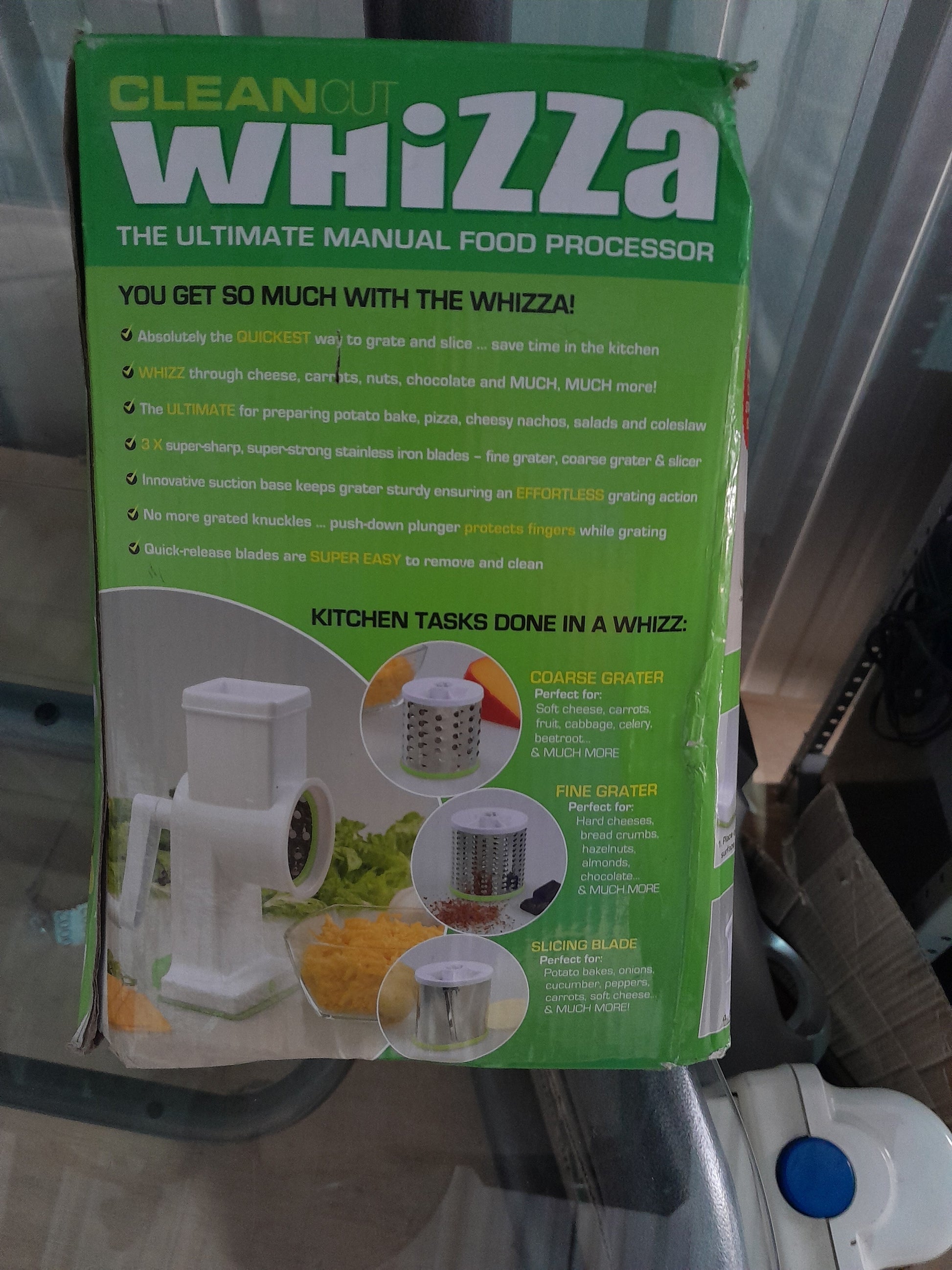 Various attachments of CleanCut Whizza including fine grater, coarse grater, and slicing blade for versatile kitchen tasks.