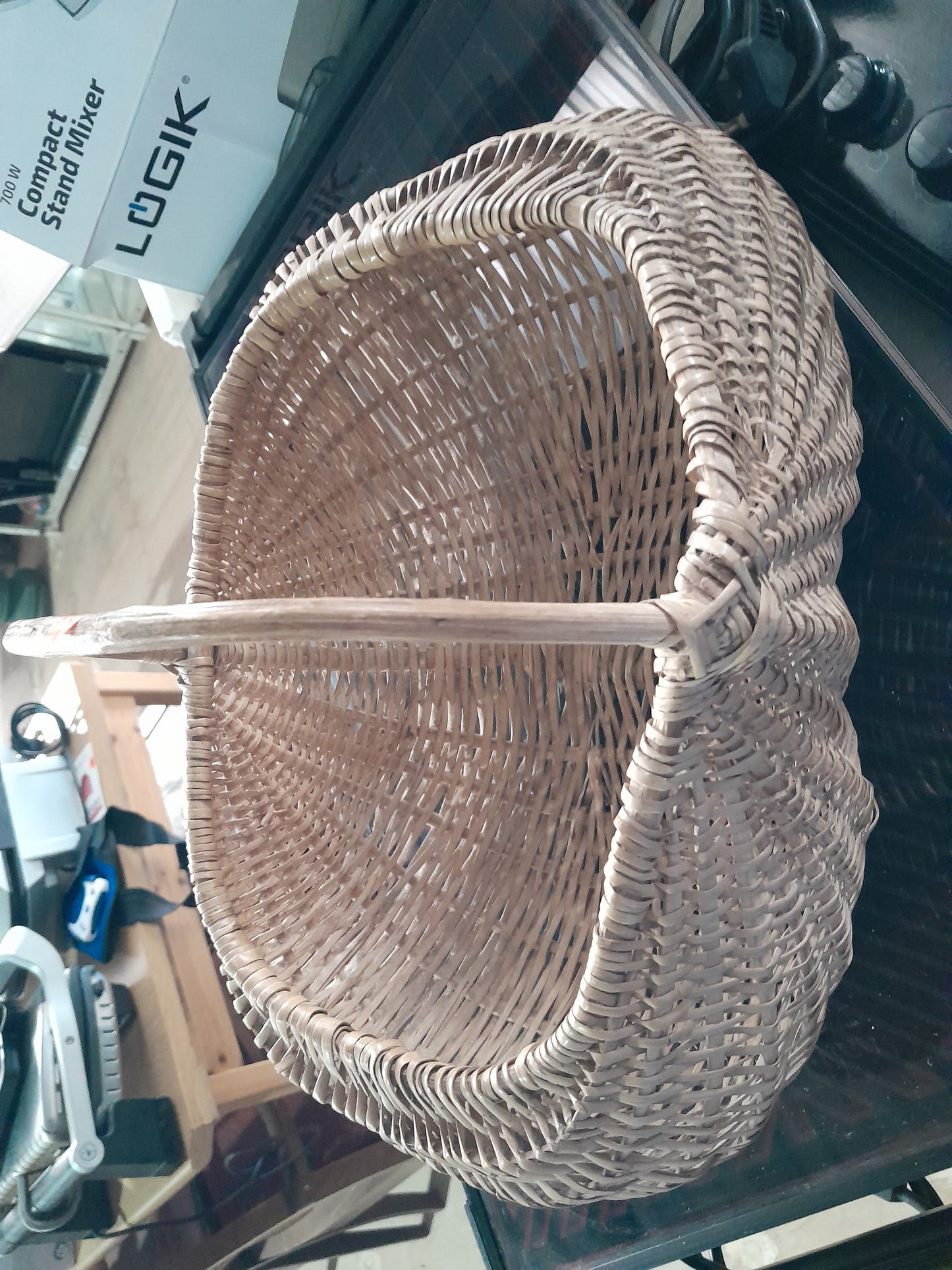 Handcrafted wicker basket, great for organizing items or enjoying a day out with snacks.