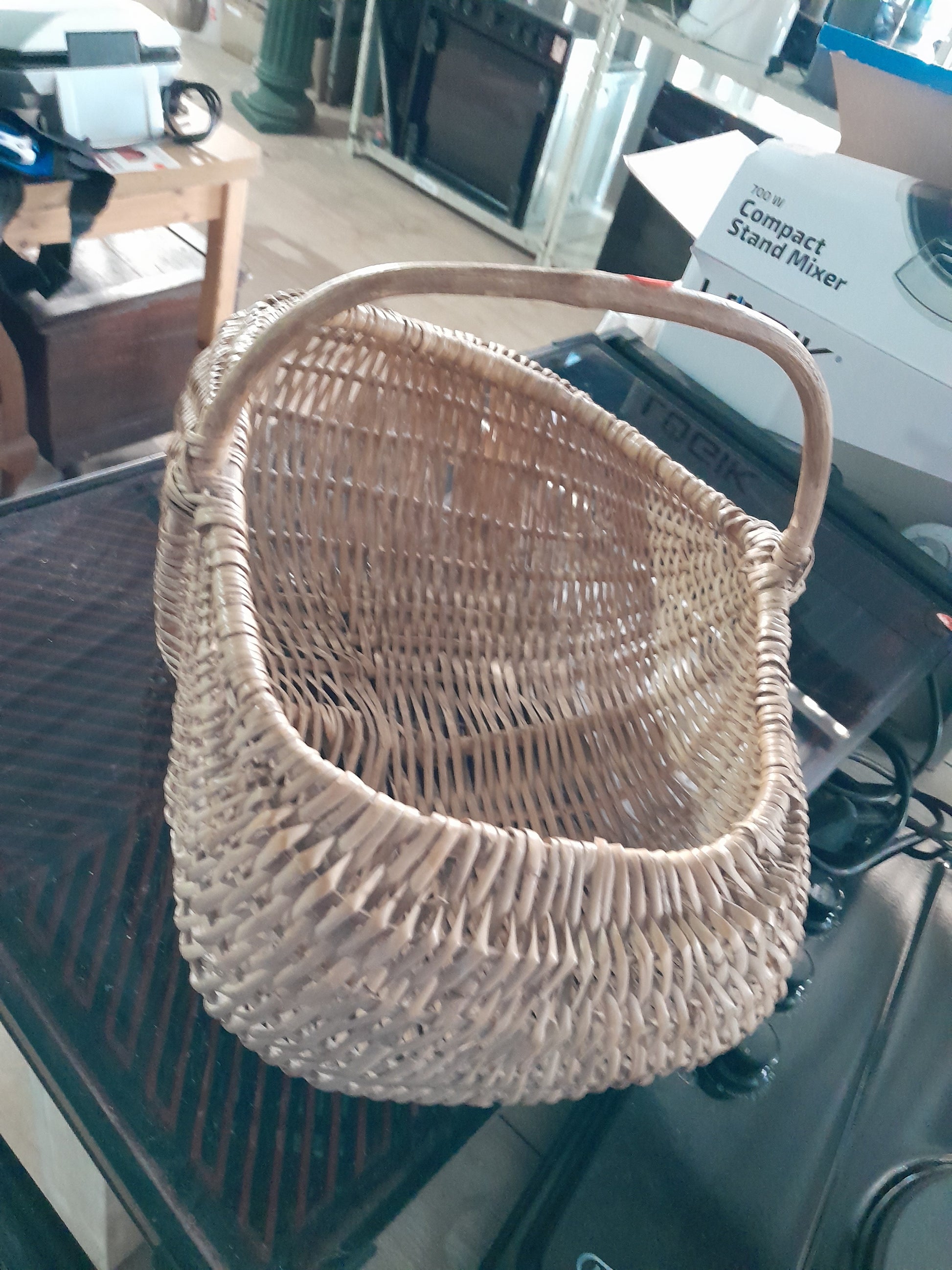 A beautiful woven wicker basket, perfect for storage or as a picnic basket for outings.
