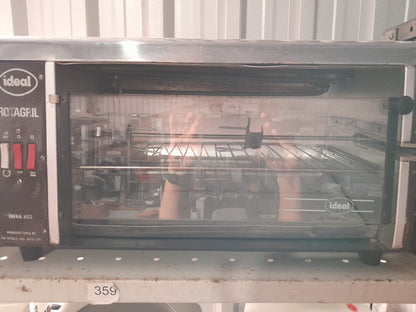 Ideal Rotagril Rotisserie displayed on shelf, perfect for any kitchen or outdoor grilling setup.