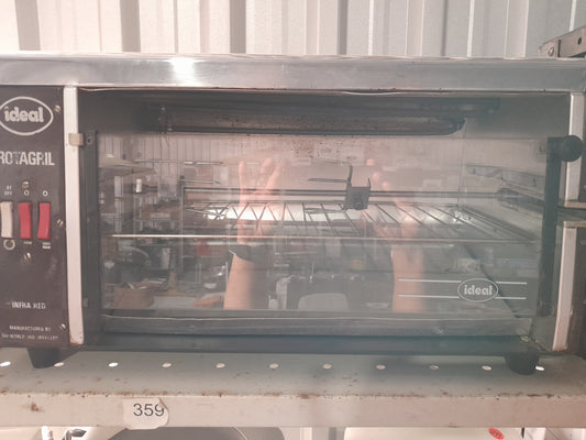 Ideal Rotagril Rotisserie displayed on shelf, perfect for any kitchen or outdoor grilling setup.