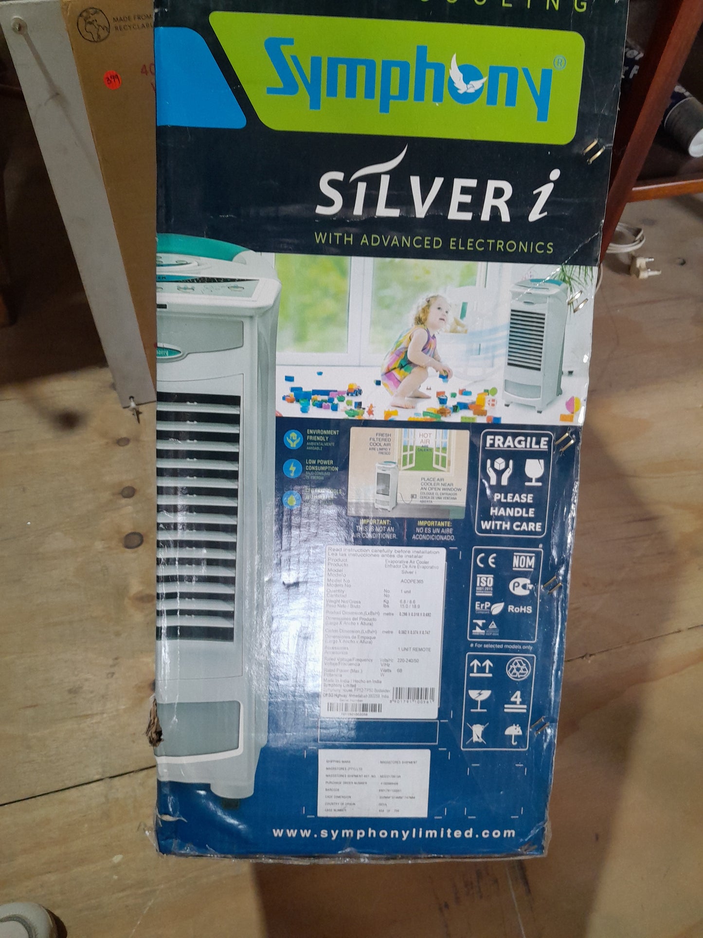 Symphony Silver i Evaporative Air Cooler box showcasing advanced electronics and energy efficiency.