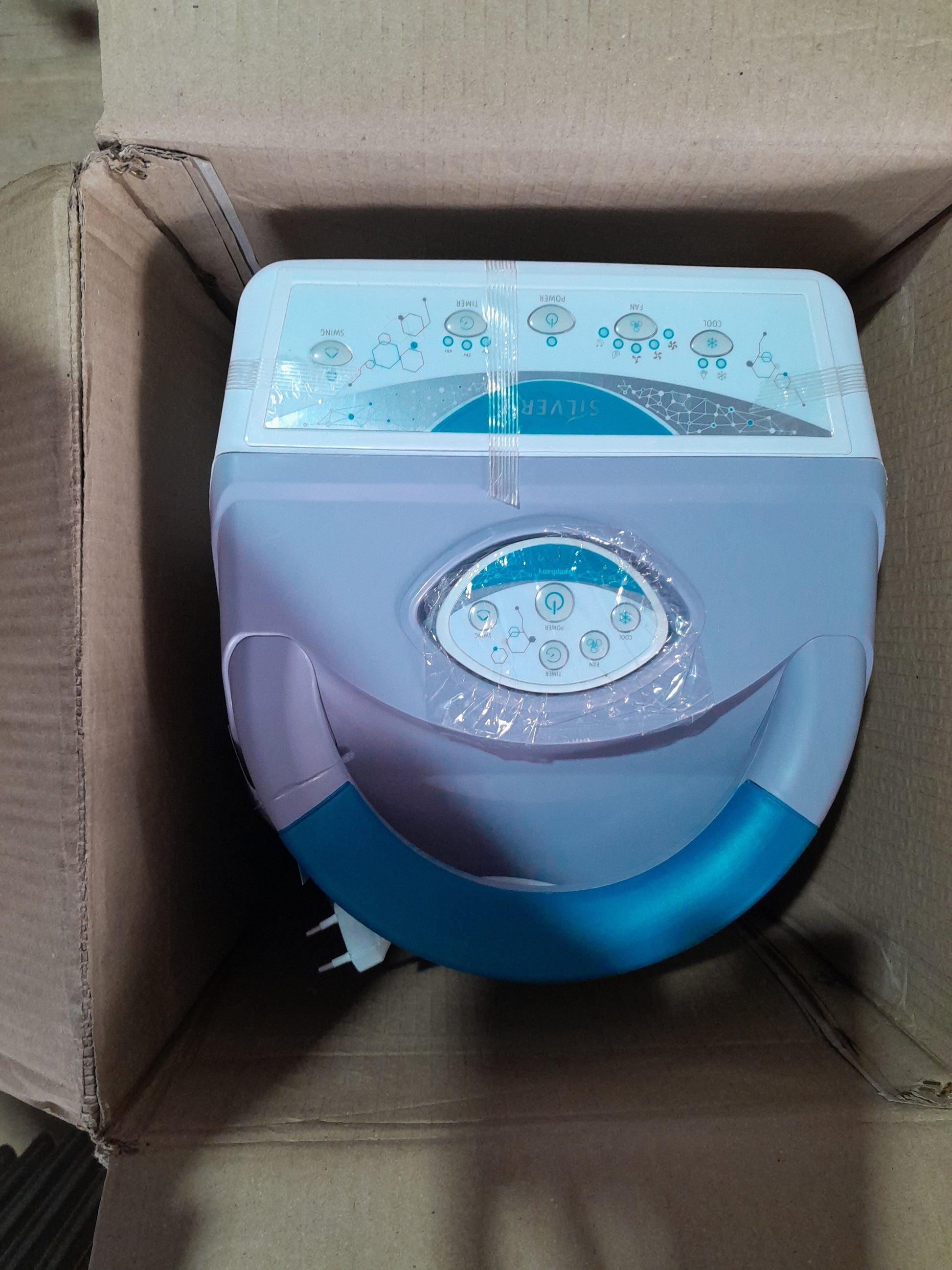 Symphony Evaporative Air Cooler packed in a box, ideal for energy-efficient cooling.