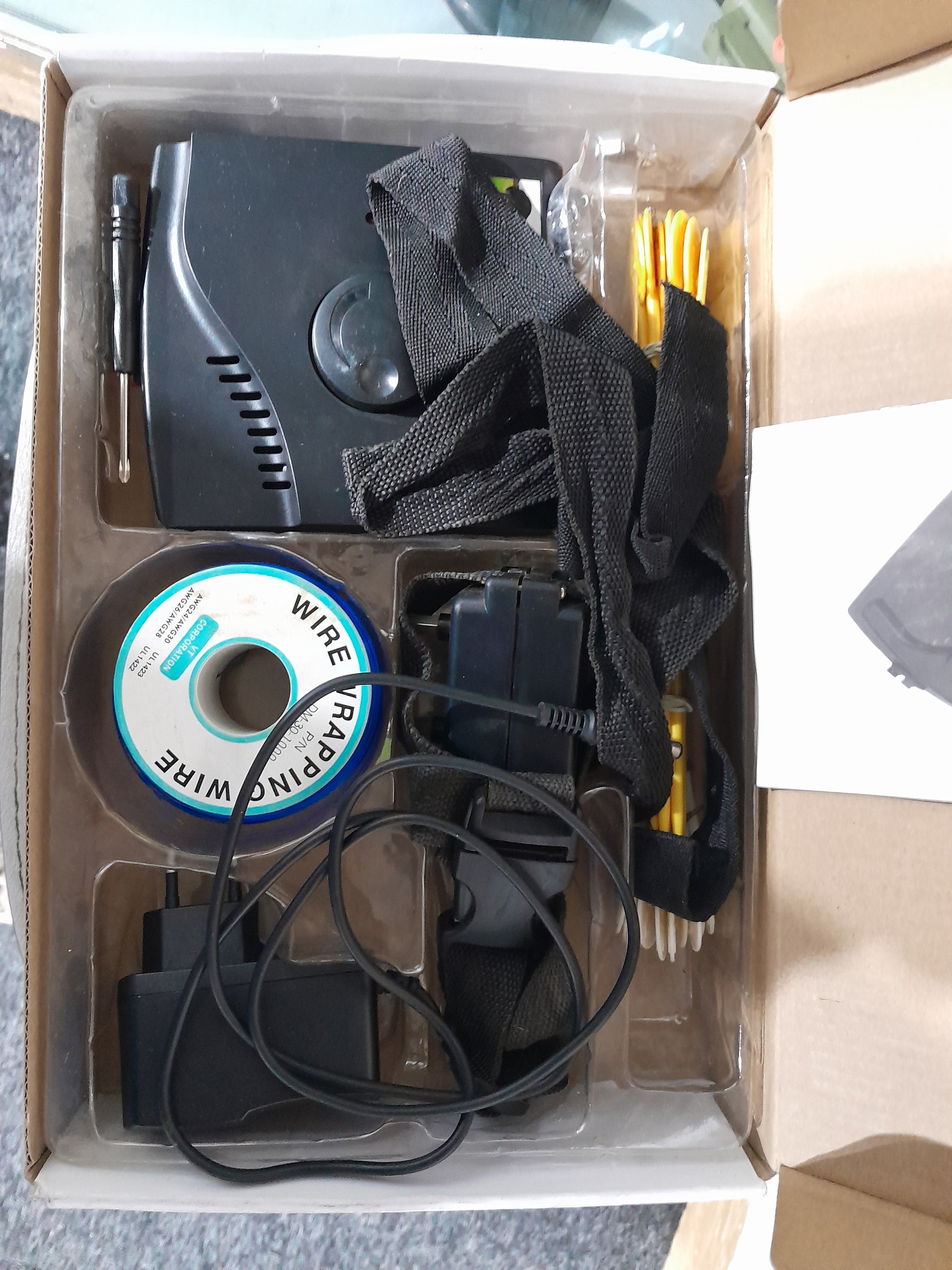Electronic pet fencing system kit featuring collar, wire, and necessary accessories for pet safety.