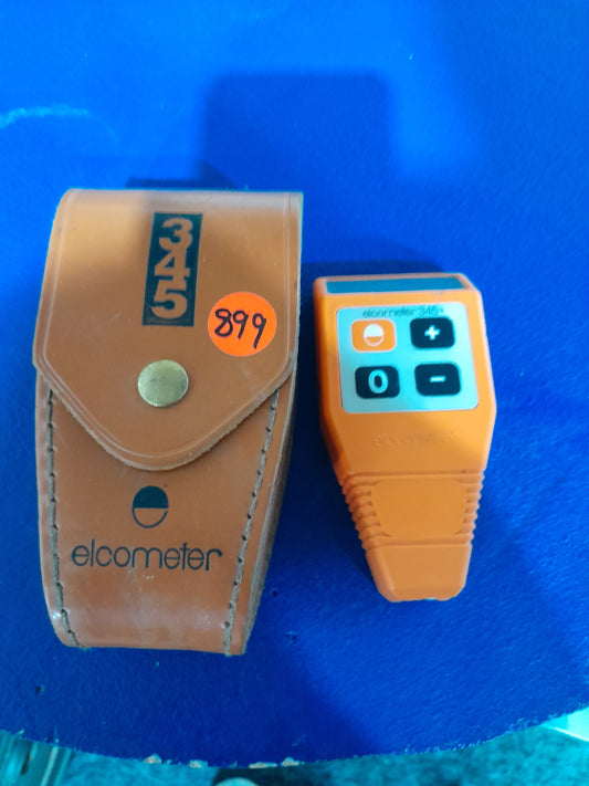 Elcometer 345 gauge and case for measuring coating thickness on metal surfaces.