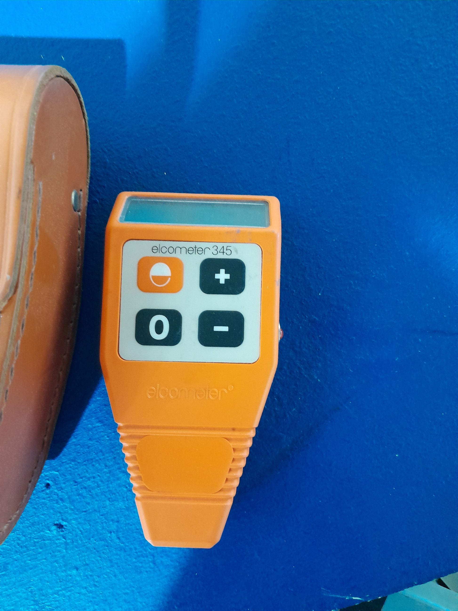 Elcometer 345 gauge displayed with leather case, perfect for secondhand tools.