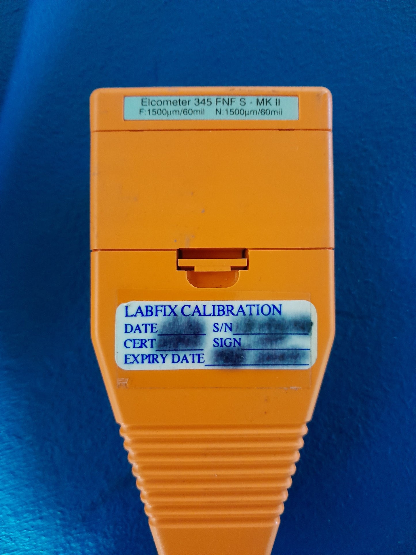 Elcometer 345 Gauge in use, perfect for professionals measuring metal coatings.