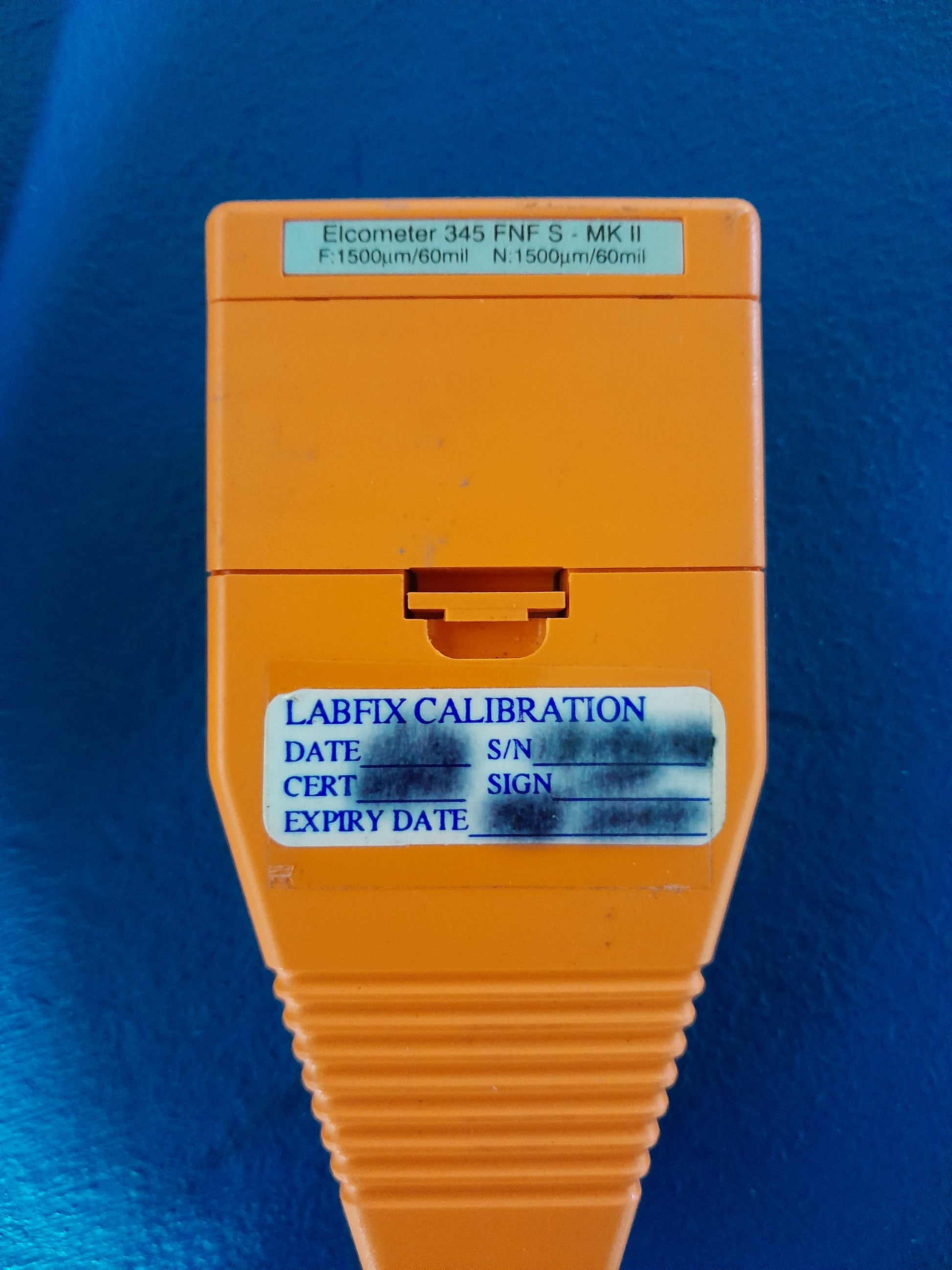 Elcometer 345 Gauge in use, perfect for professionals measuring metal coatings.
