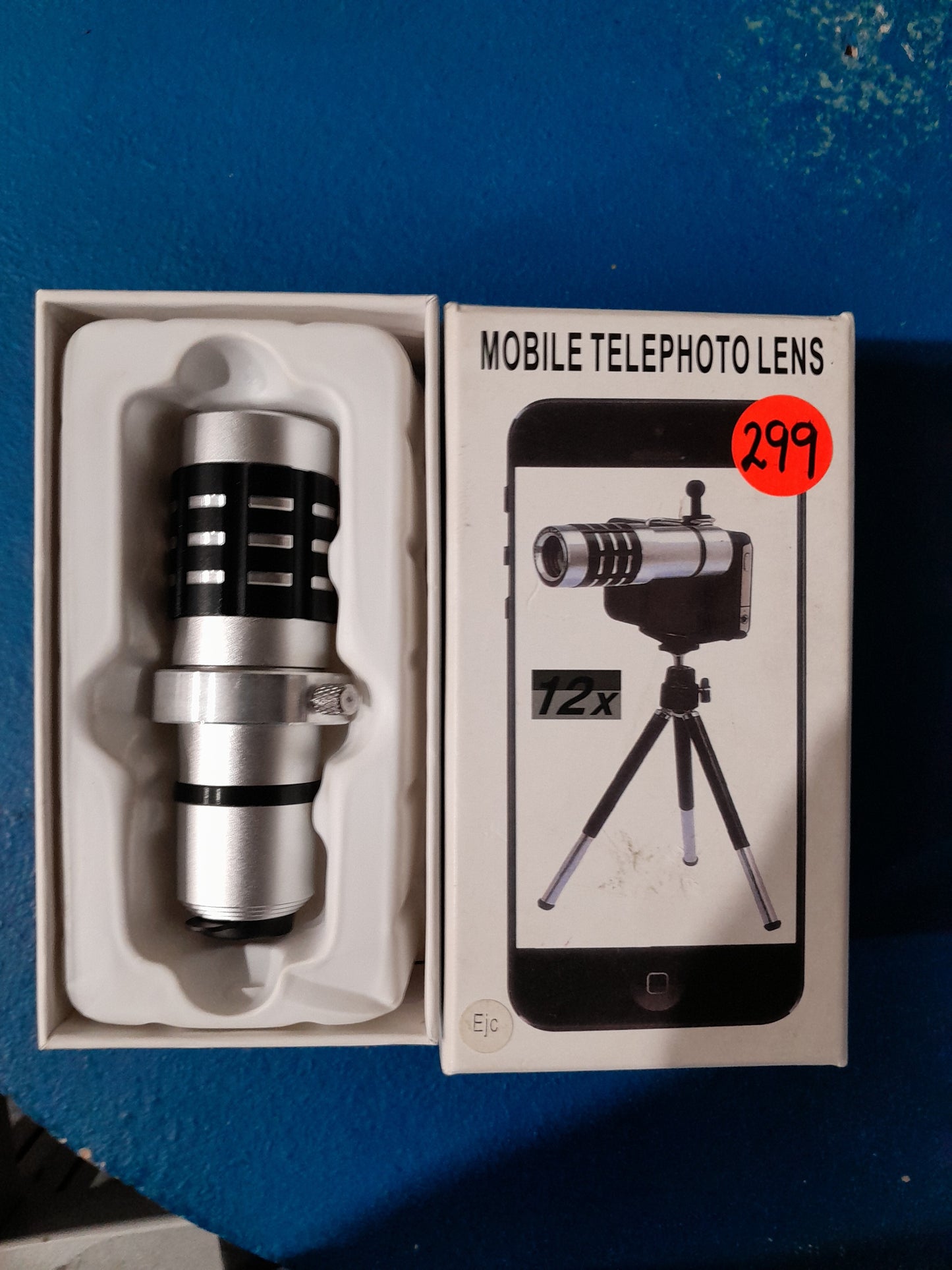 Mobile telephoto lens and tripod set for enhanced photography of distant objects.