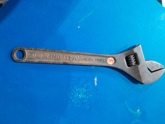 Maxpower adjustable spanner on a blue background, perfect for gripping nuts and bolts.