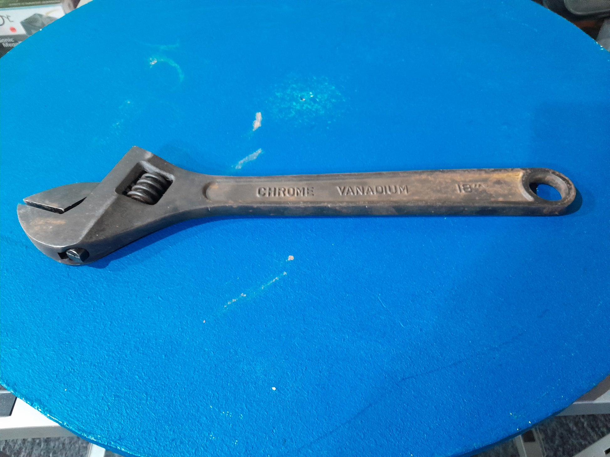 Durable Maxpower adjustable wrench on a vibrant blue background, essential for DIY projects.