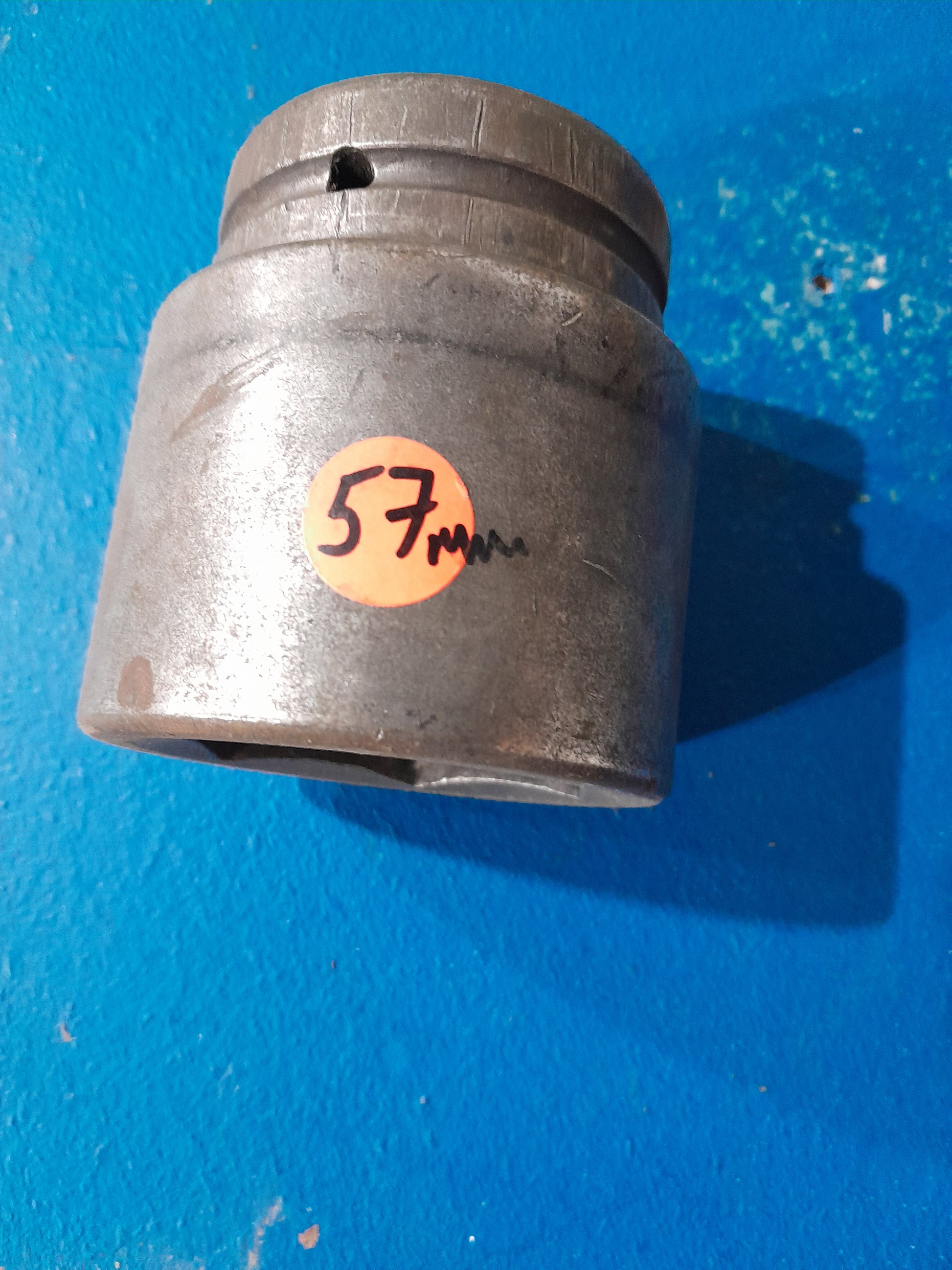 Durable 57mm socket designed for heavy-duty applications, ideal for loosening or tightening bolts.