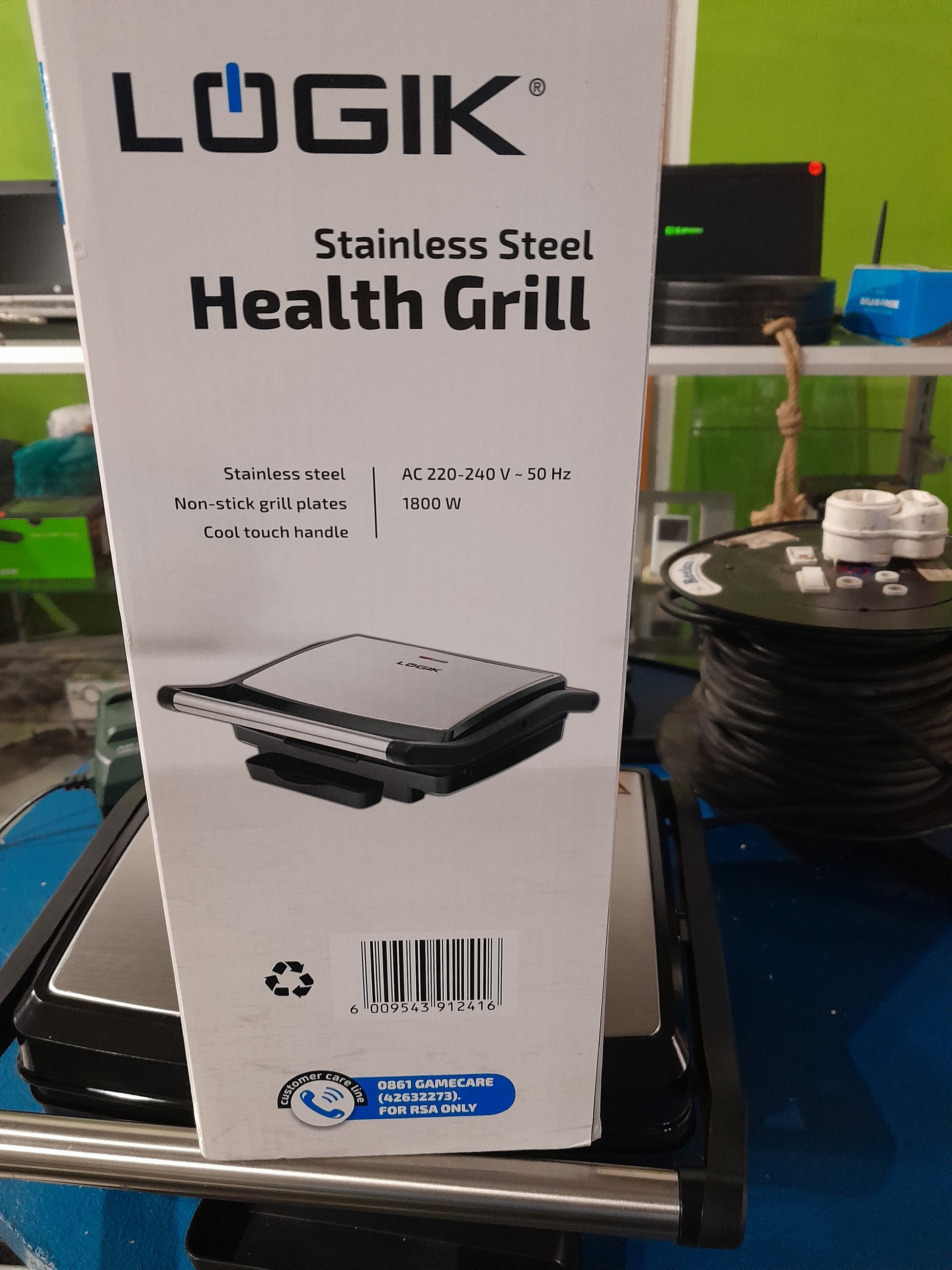 Side view of Logik Health Grill showcasing its sleek design and cool touch handle.