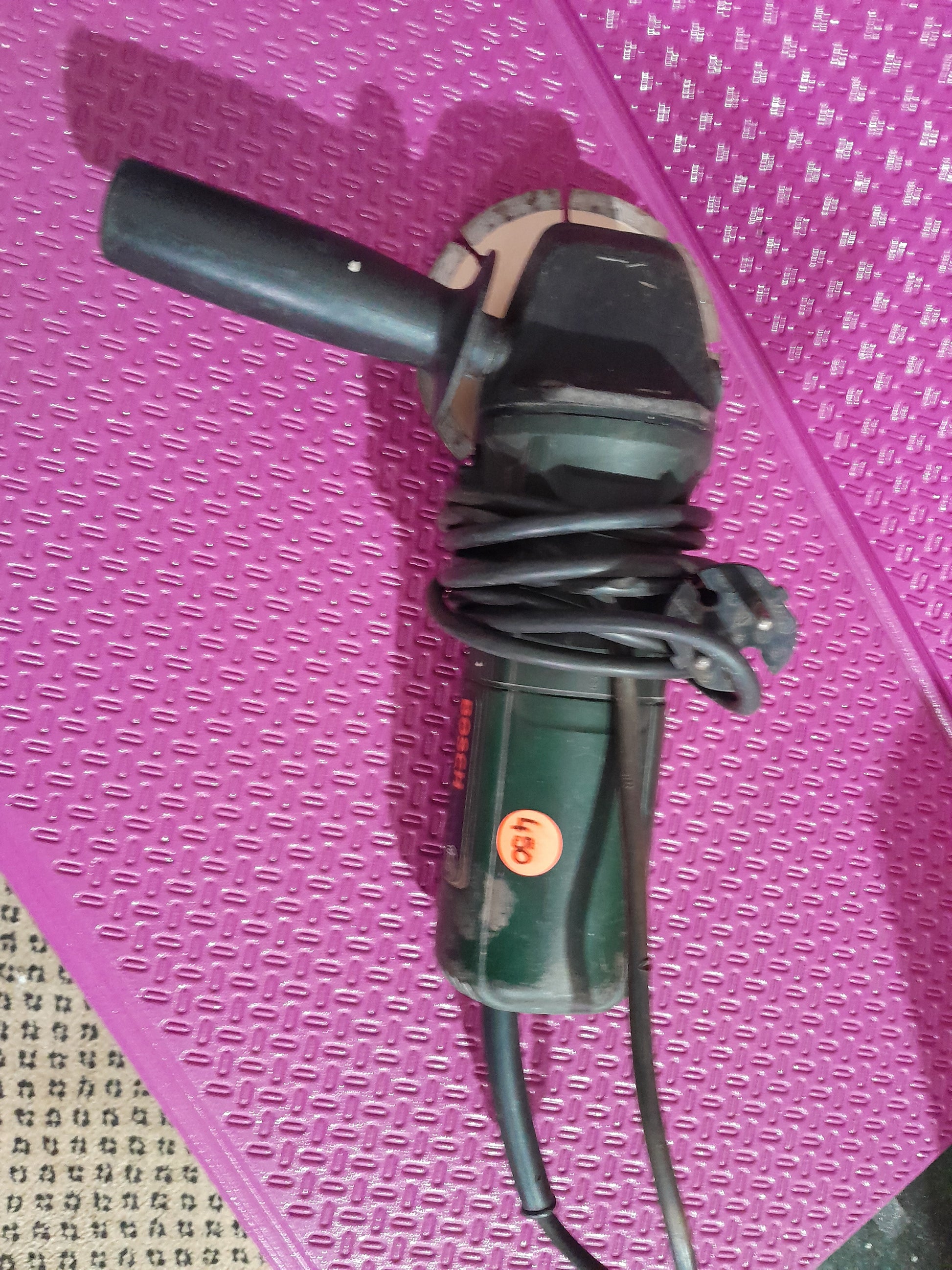 Bosch PWS 5-115 angle grinder, a versatile power tool for home improvement and professional use.