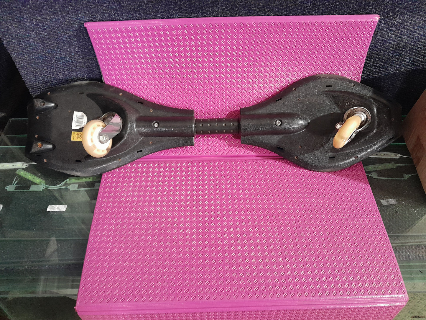 Close-up of a Surge Caster Board, showcasing its unique design and flexibility for riders.
